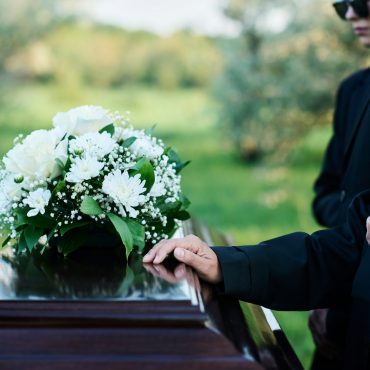 Cropped shot of mature woman and her family in mourning attire